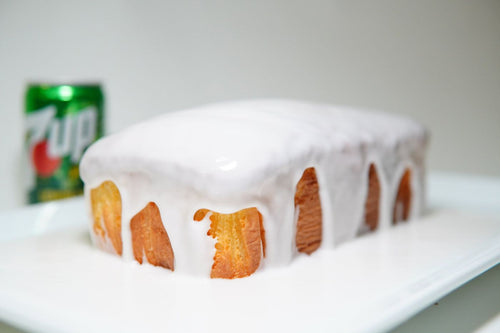 7Up pound cake loaf covered in white glaze