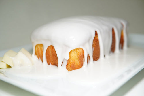 Butter Cake pound cake loaf under a thick white glaze