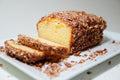 Caramel Pecan Butter Pound cake coated in chopped pecans, sliced